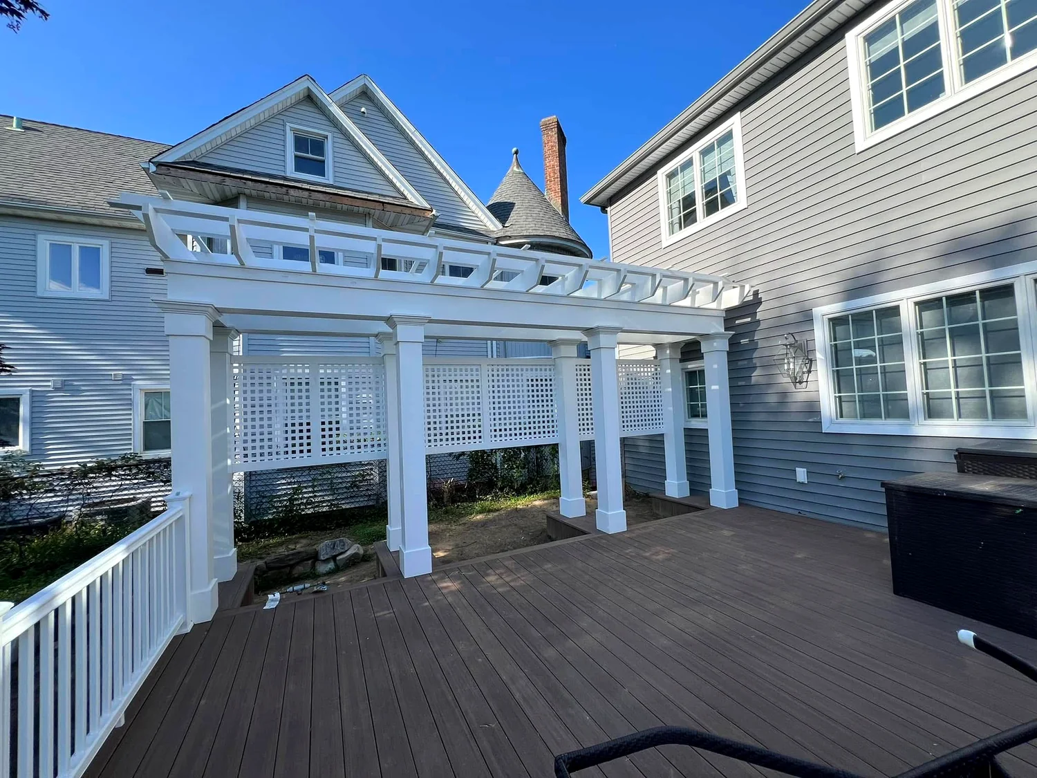 Composite deck and white pergola