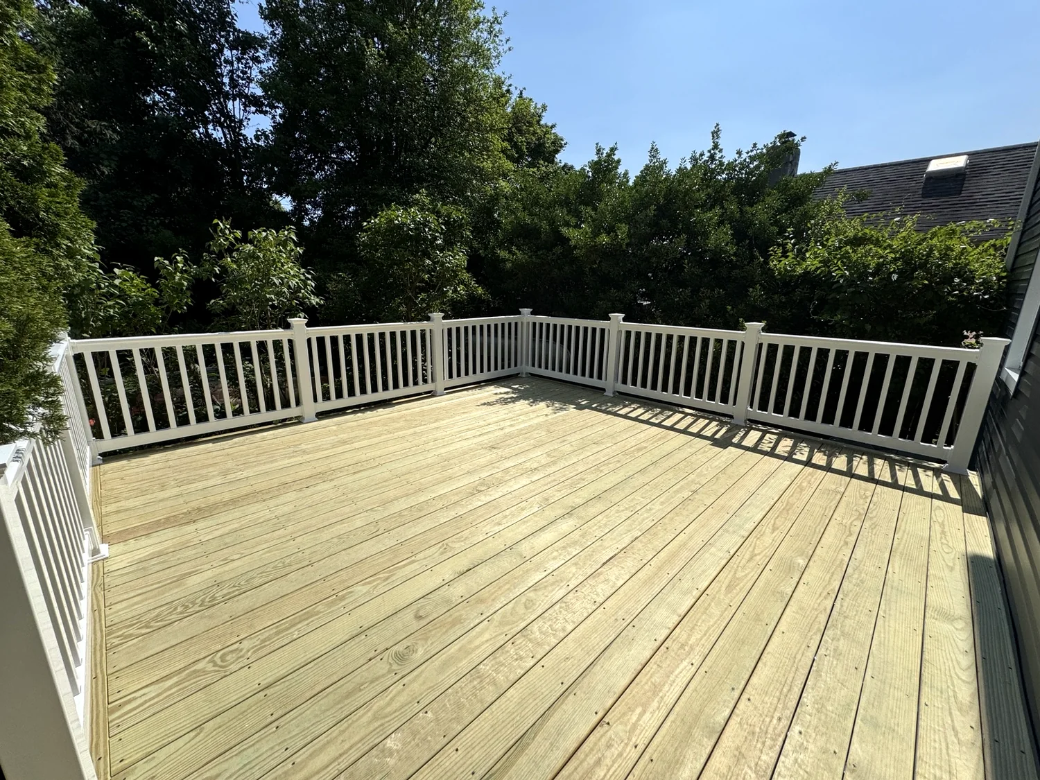 Large deck with white railing